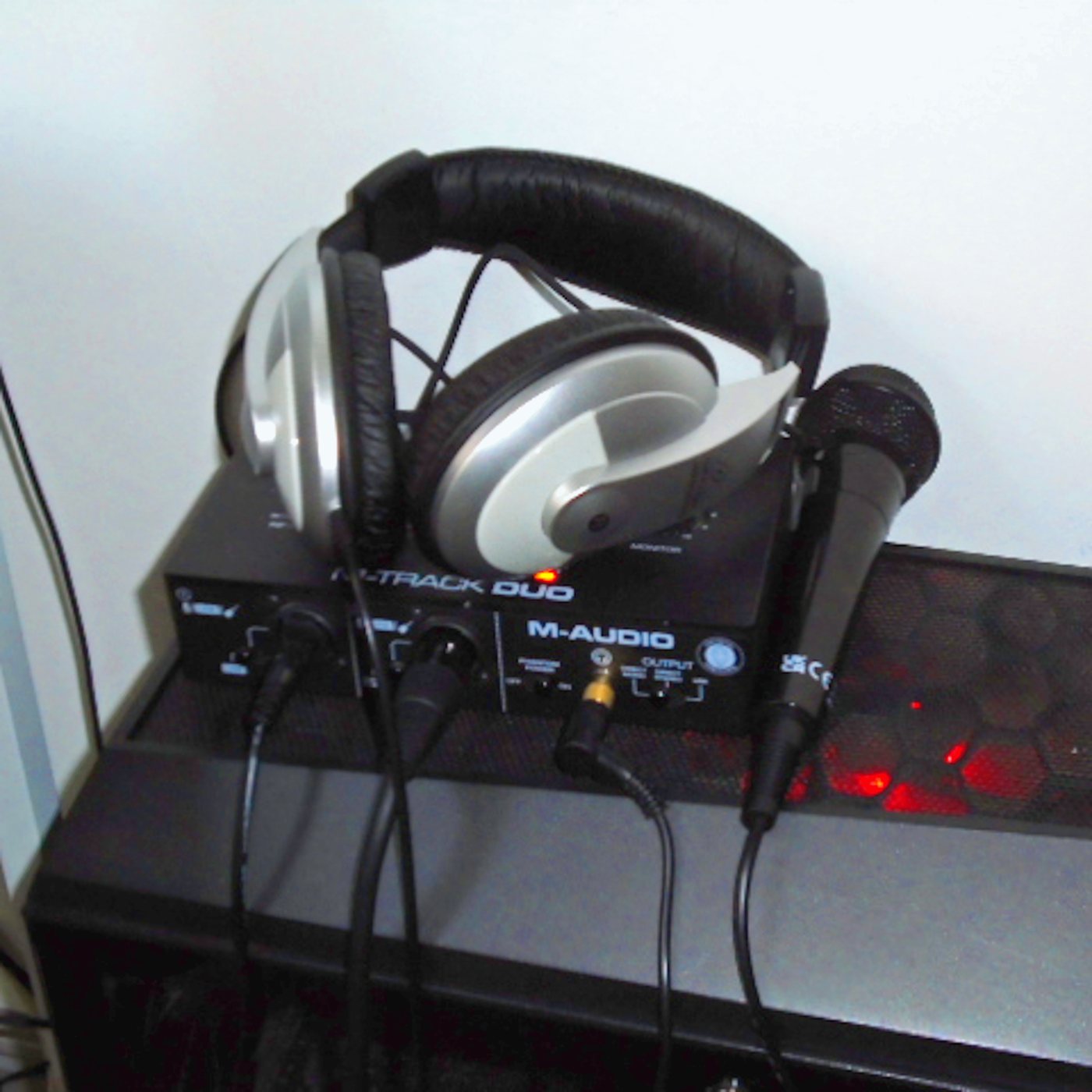 Honda Jazz artwork: headphones on an audio interface beside a handheld microphone